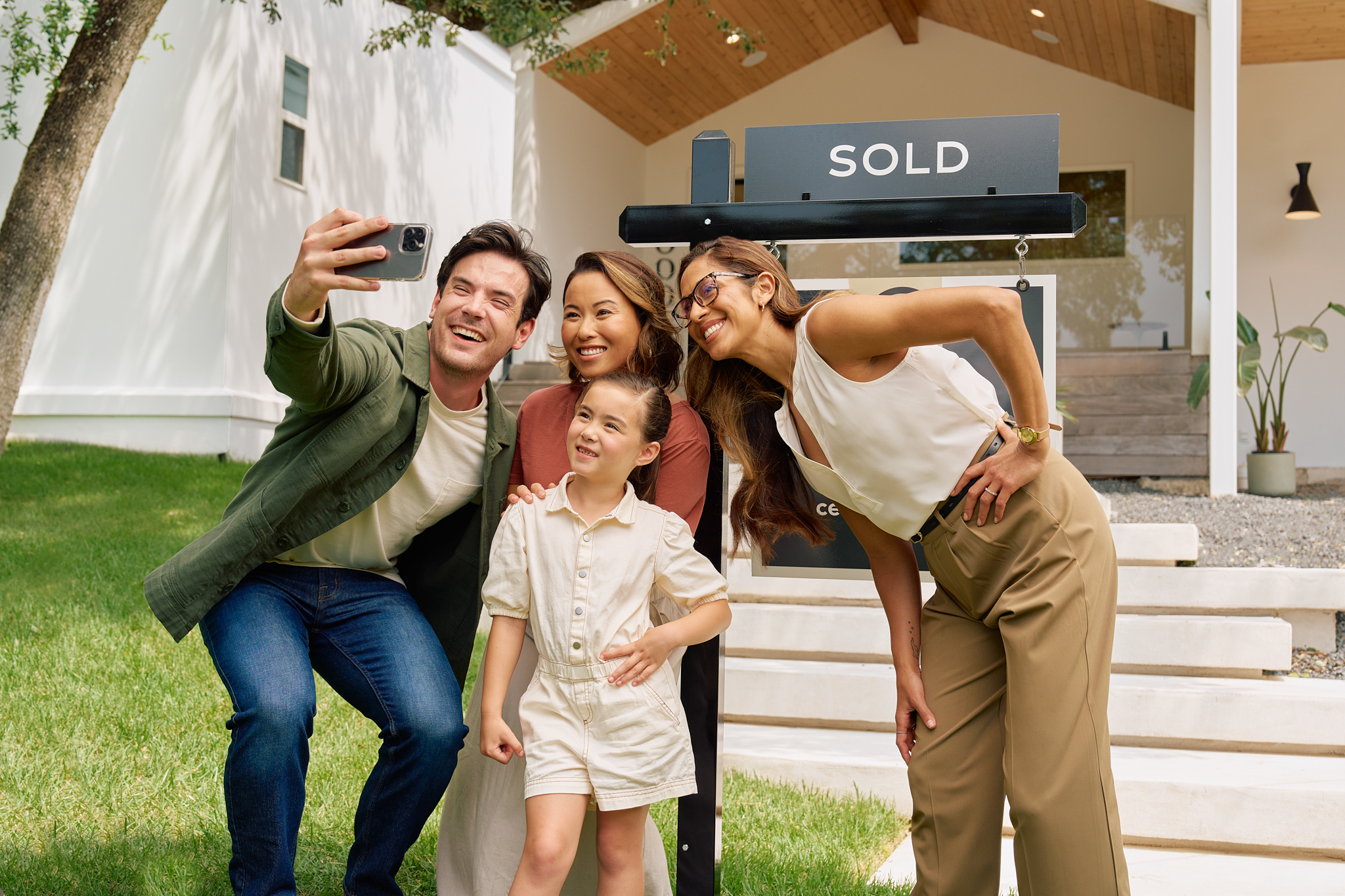 Family in front of their new home!